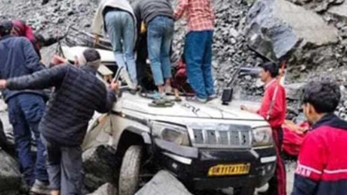 Two killed as boulder falls on vehicle